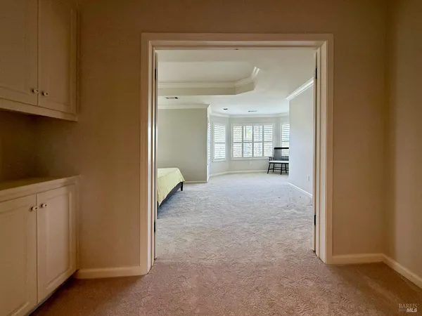 a bed sitting in a room next to a window