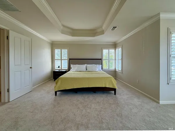 a large white kitchen with a large window