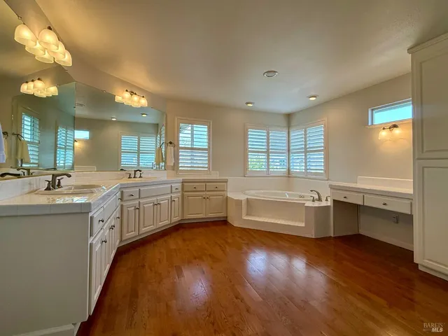 a bathroom with a granite countertop shower