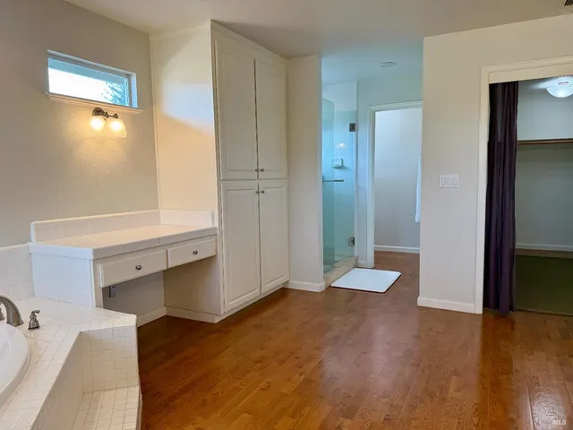 a bathroom with a double vanity sink and a mirror