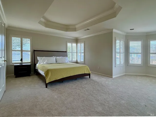 a bedroom with a bed and a cabinets