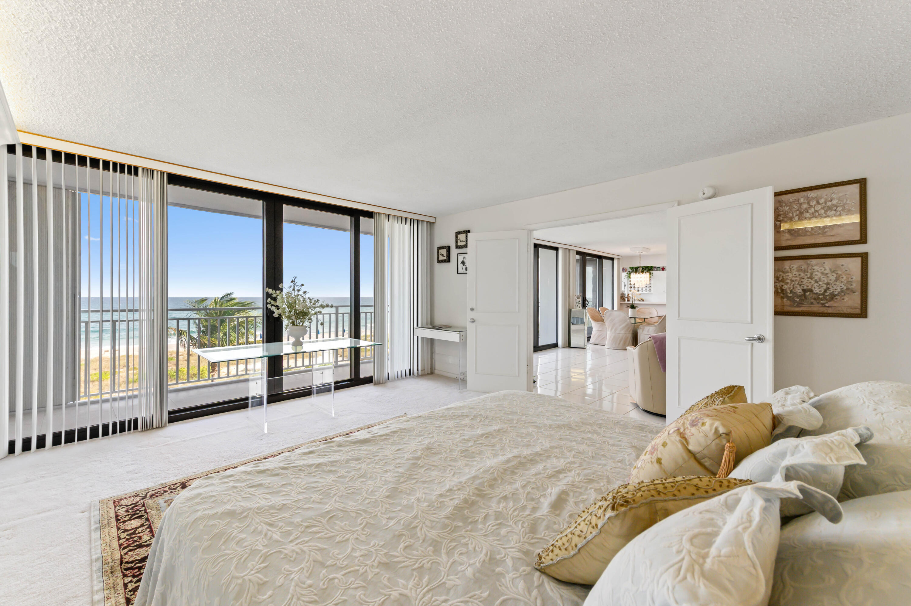 2600 South Ocean Boulevard, Unit 3E Boca Raton, FL 33432 - Photo 17 of 56 a view of a bedroom with a large bed and a large window
