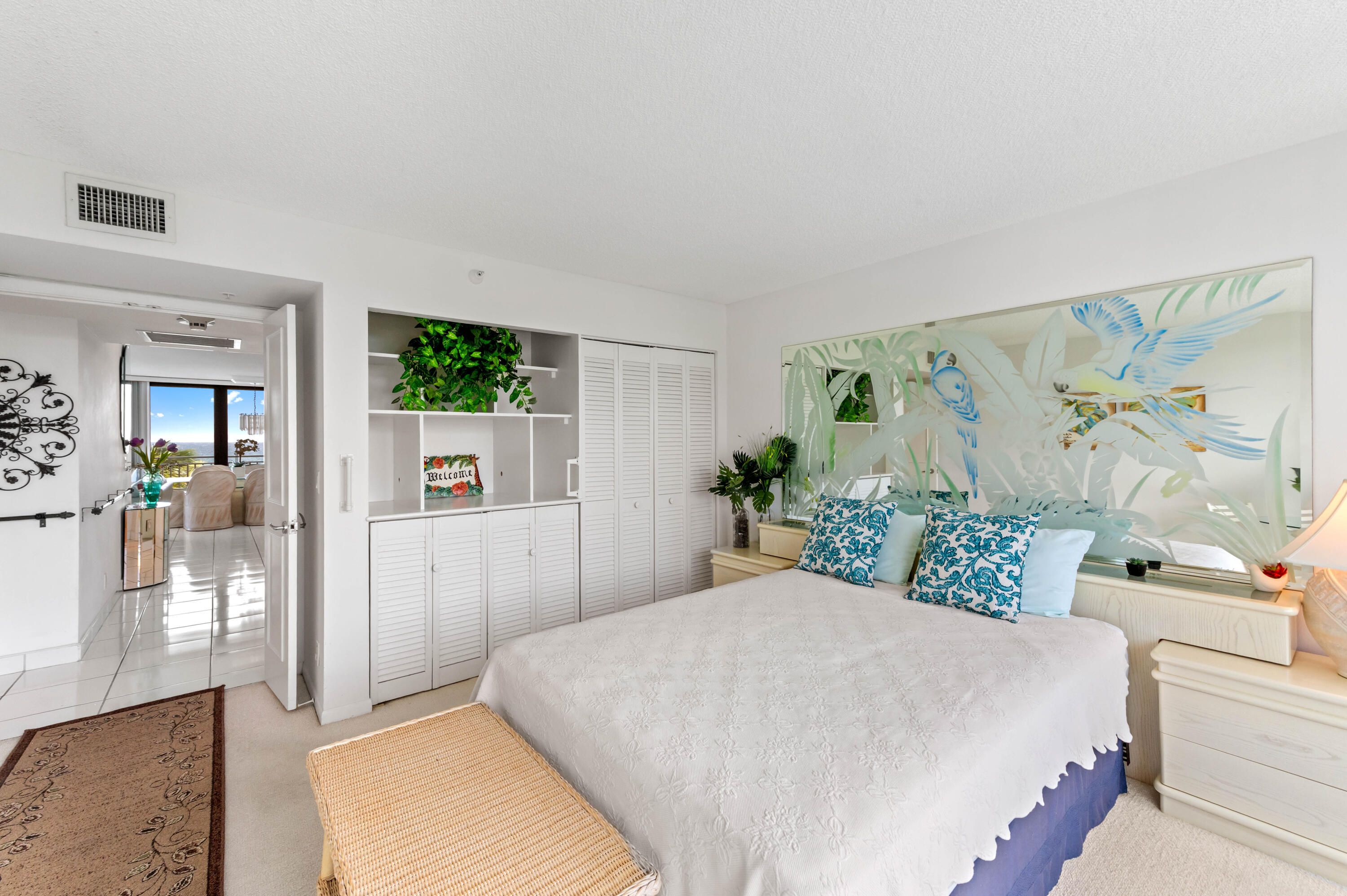 2600 South Ocean Boulevard, Unit 3E Boca Raton, FL 33432 - Photo 21 of 56 a bedroom with a large bed and a potted plant