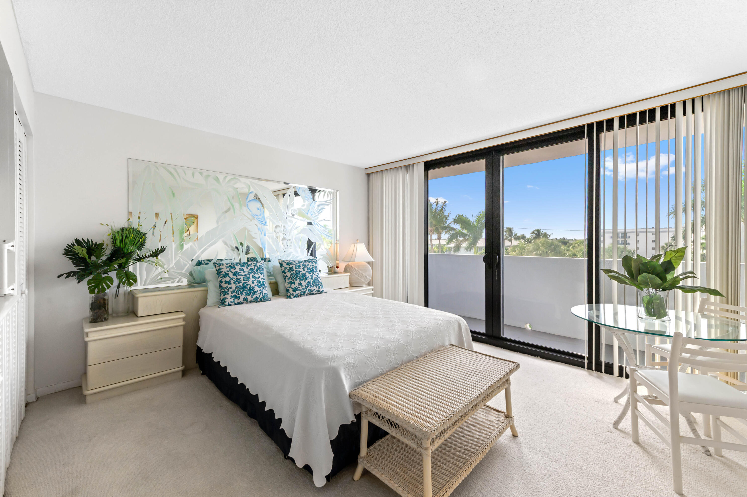 2600 South Ocean Boulevard, Unit 3E Boca Raton, FL 33432 - Photo 22 of 56 a bedroom with a large bed and a potted plant