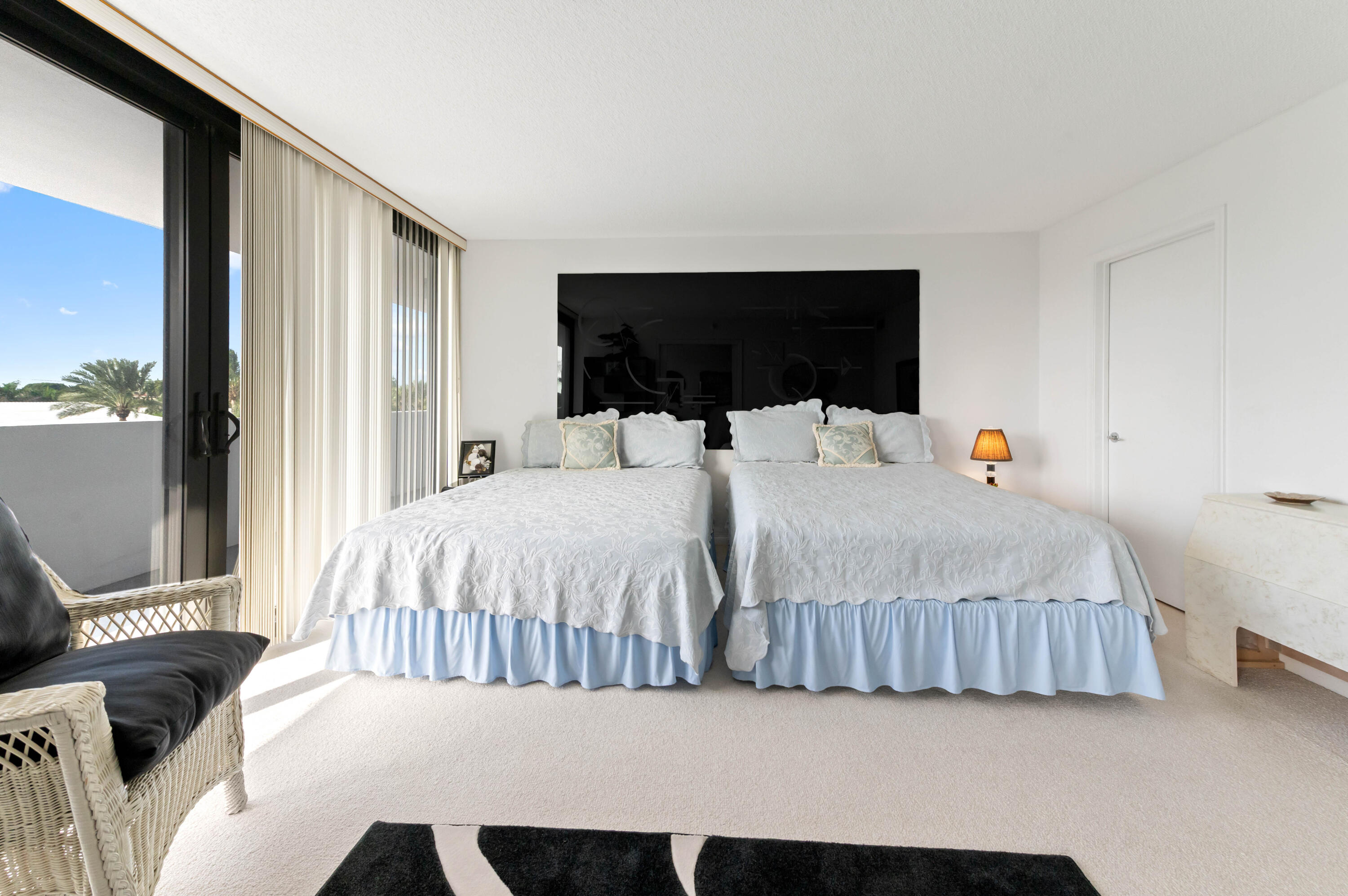 2600 South Ocean Boulevard, Unit 3E Boca Raton, FL 33432 - Photo 27 of 56 a bedroom with a bed and glass window