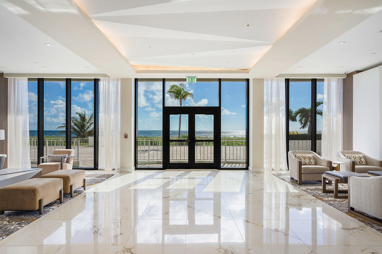 2600 South Ocean Boulevard, Unit 3E Boca Raton, FL 33432 - Photo 29 of 56 a spacious bedroom with a large bed and a large window