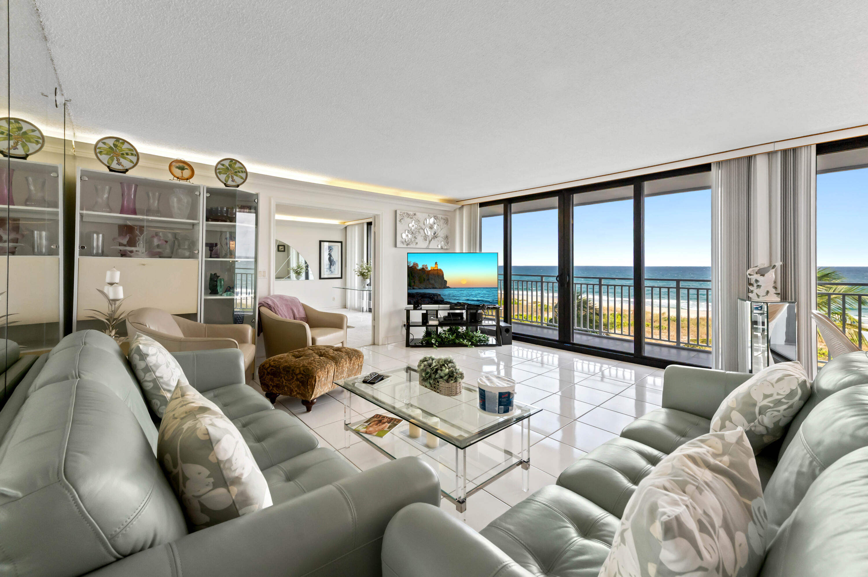 2600 South Ocean Boulevard, Unit 3E Boca Raton, FL 33432 - Photo 5 of 56 a living room with furniture large window and flat screen tv