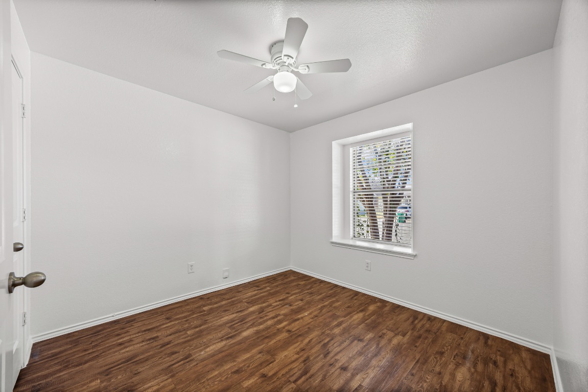 4503 Halliday Avenue Austin, TX 78725 - Photo 13 of 21 an empty room with a window and a ceiling fan