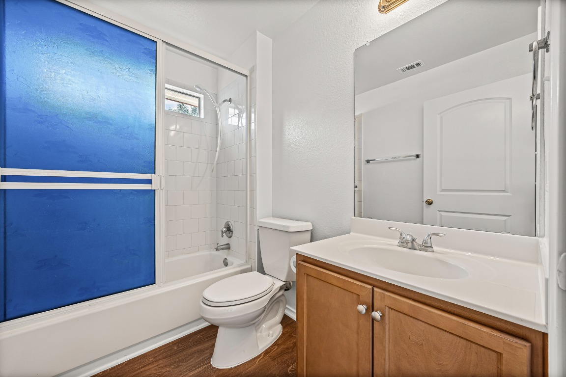 4503 Halliday Avenue Austin, TX 78725 - Photo 15 of 21 a bathroom with a sink a toilet and shower