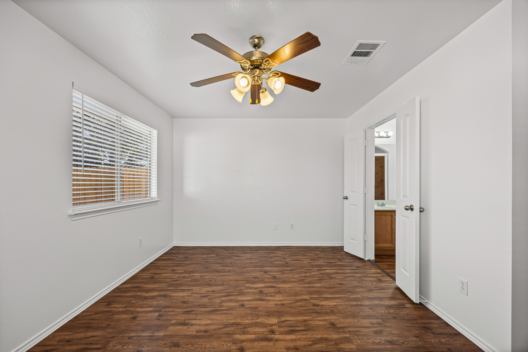 4503 Halliday Avenue Austin, TX 78725 - Photo 19 of 21 Spare room featuring dark wood-type flooring and ceiling fan