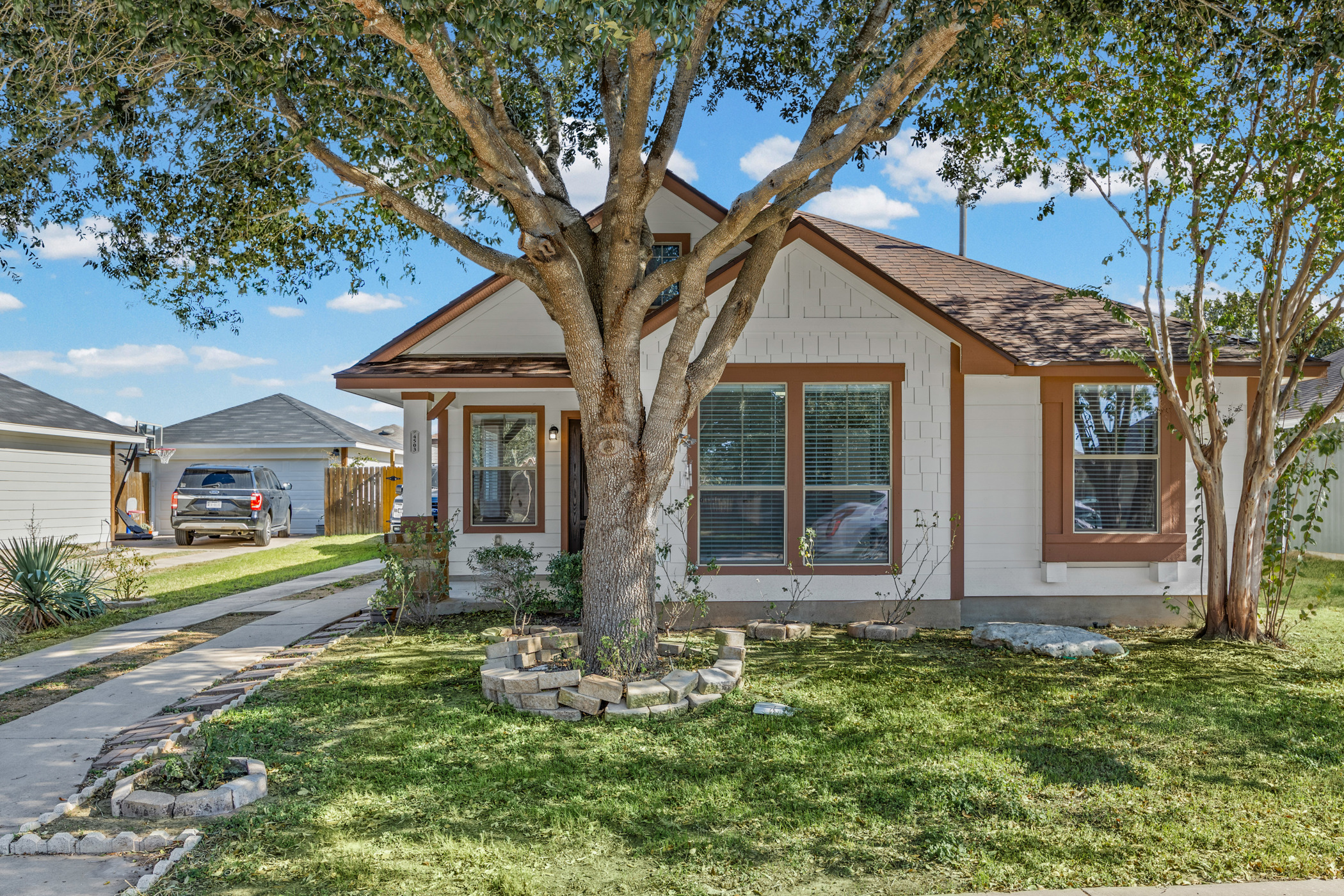 4503 Halliday Avenue Austin, TX 78725 - Photo 4 of 21 View of front of property featuring covered porch and a front yard