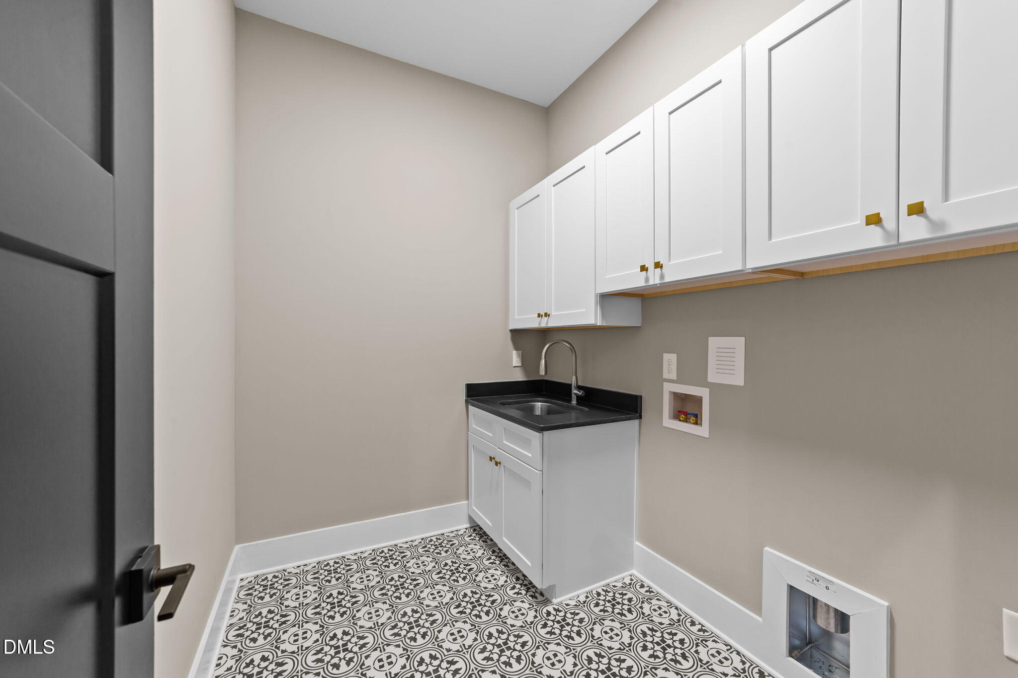 2590 Lassiter Road Four Oaks, NC 27524 - Photo 28 of 72 a kitchen with granite countertop a stove a sink and white cabinets