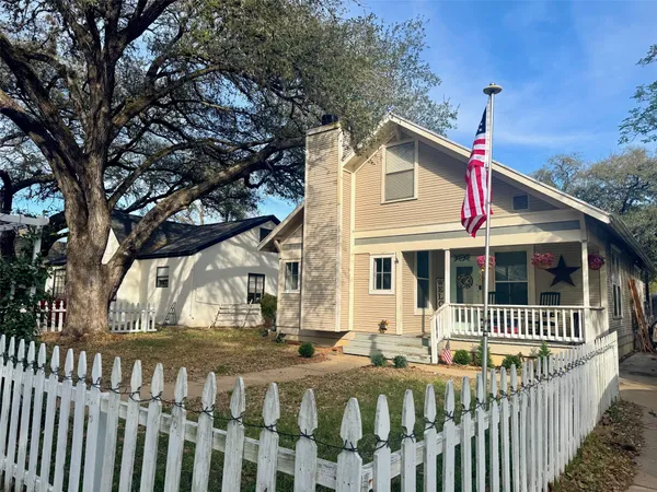 a front view of a house with a deck