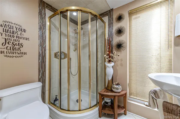 a bathroom with a toilet and a mirror