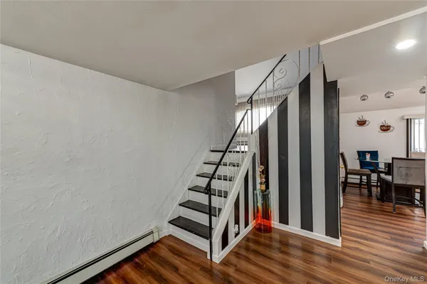 a view of entryway with wooden floor