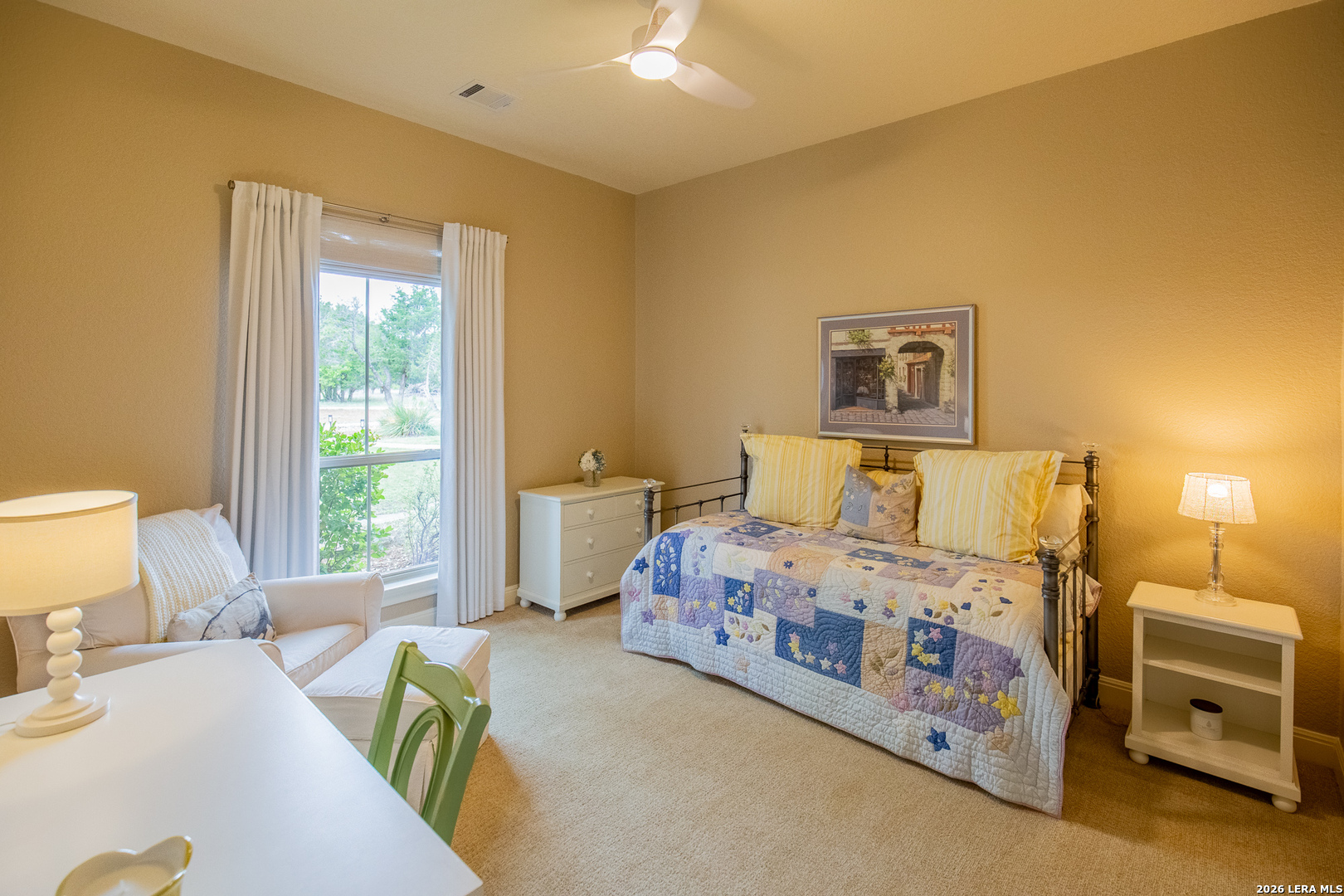 395 Bluff Creek Road North Center Point, TX 78010 - Photo 19 of 50 a bedroom with a bed and a window