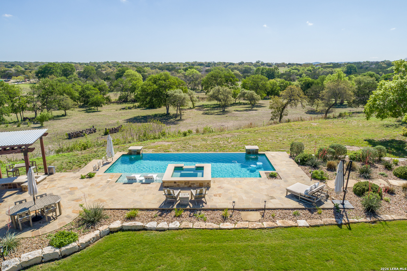 395 Bluff Creek Road North Center Point, TX 78010 - Photo 25 of 50 a view of a garden with lawn chairs