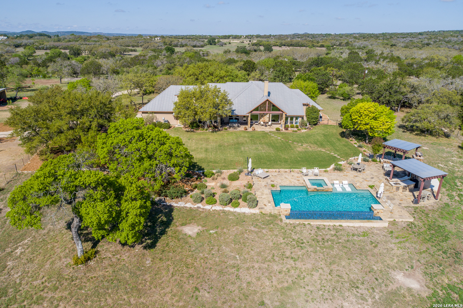395 Bluff Creek Road North Center Point, TX 78010 - Photo 26 of 50 an aerial view of a house with a garden