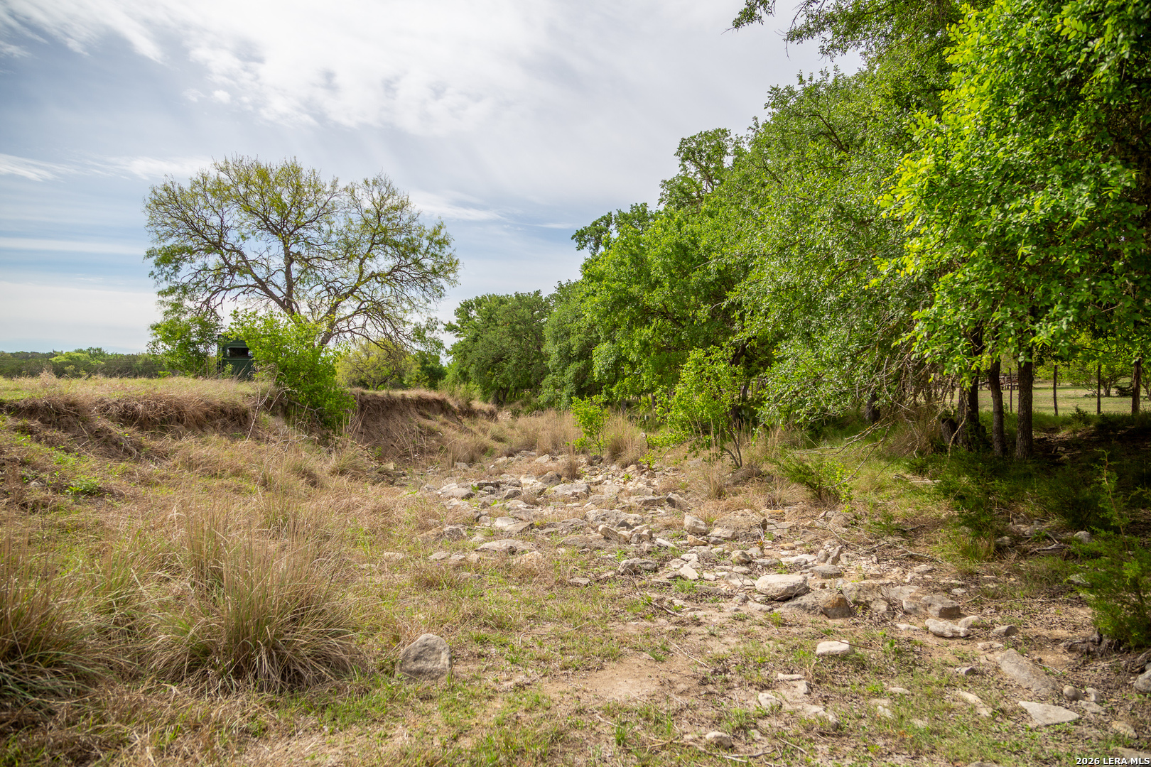 395 Bluff Creek Road North Center Point, TX 78010 - Photo 42 of 50 a view of a lake with a yard