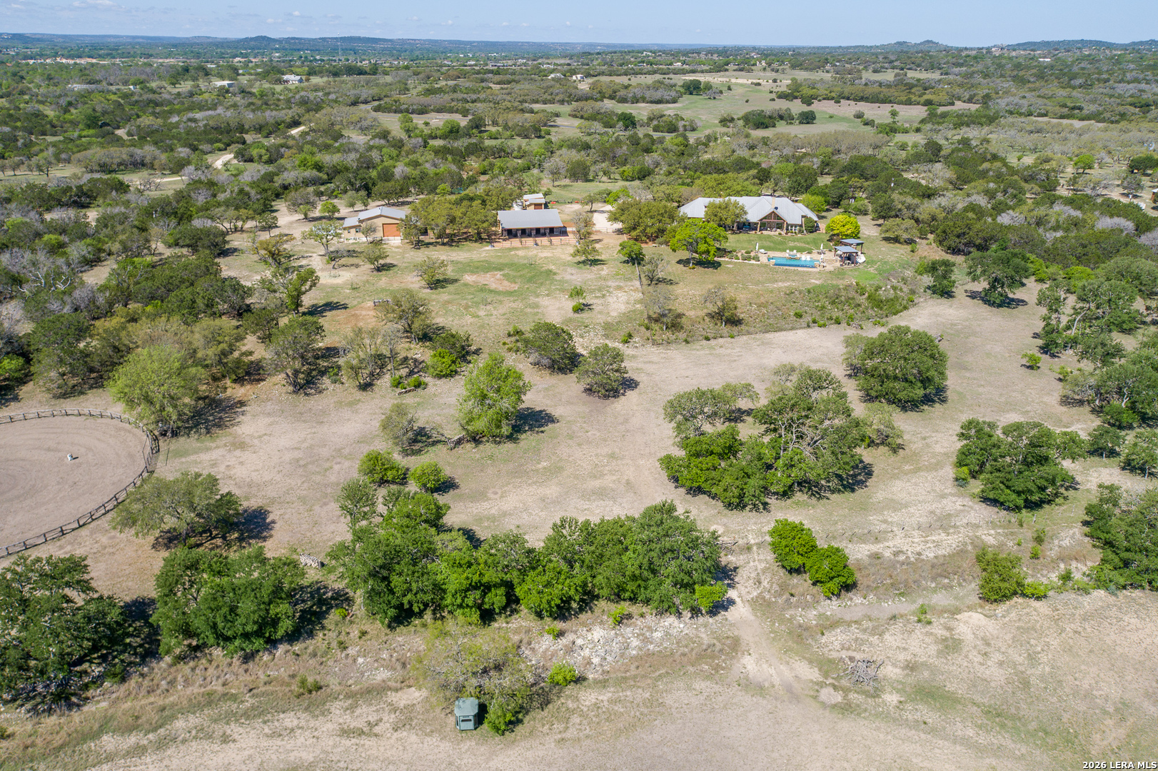 395 Bluff Creek Road North Center Point, TX 78010 - Photo 49 of 50 an aerial view of residential houses with outdoor space and trees