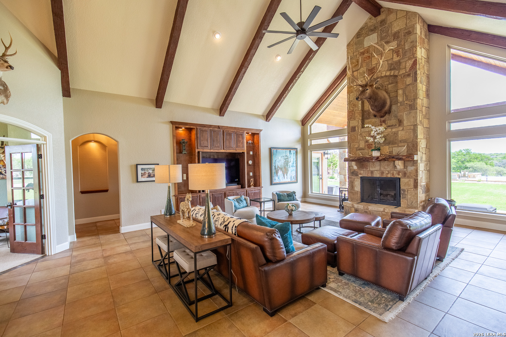 395 Bluff Creek Road North Center Point, TX 78010 - Photo 9 of 50 a living room with furniture and a fireplace