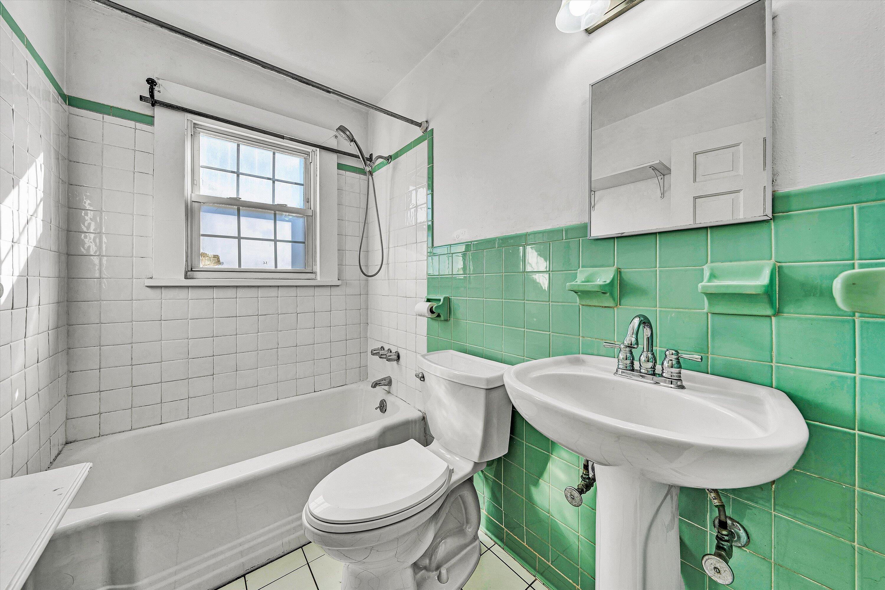810 Windsor Avenue Southwest Roanoke, VA 24015 - Photo 12 of 21 a bathroom with a sink toilet and shower