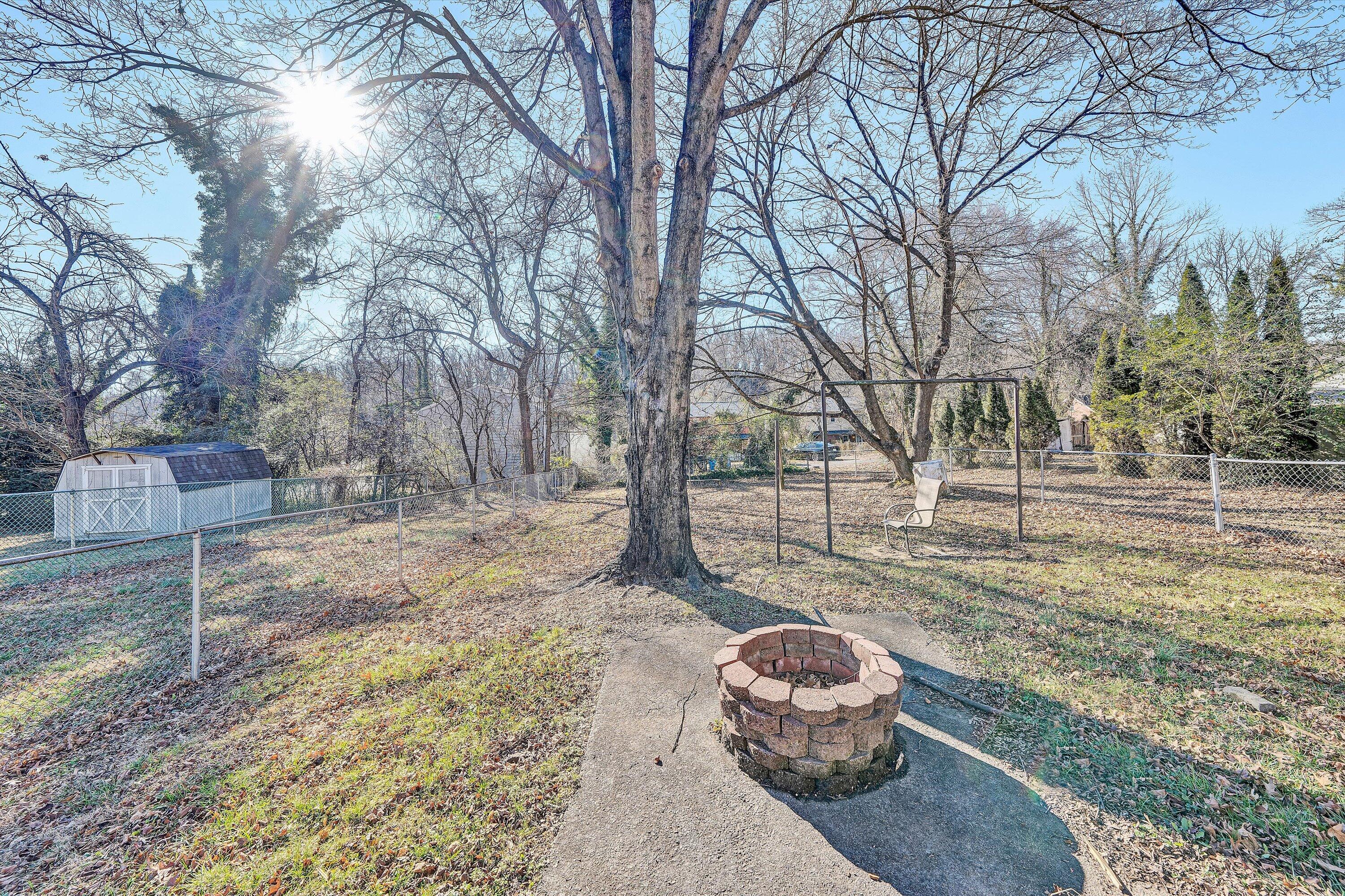 810 Windsor Avenue Southwest Roanoke, VA 24015 - Photo 19 of 21 a backyard of a house with a table and chairs
