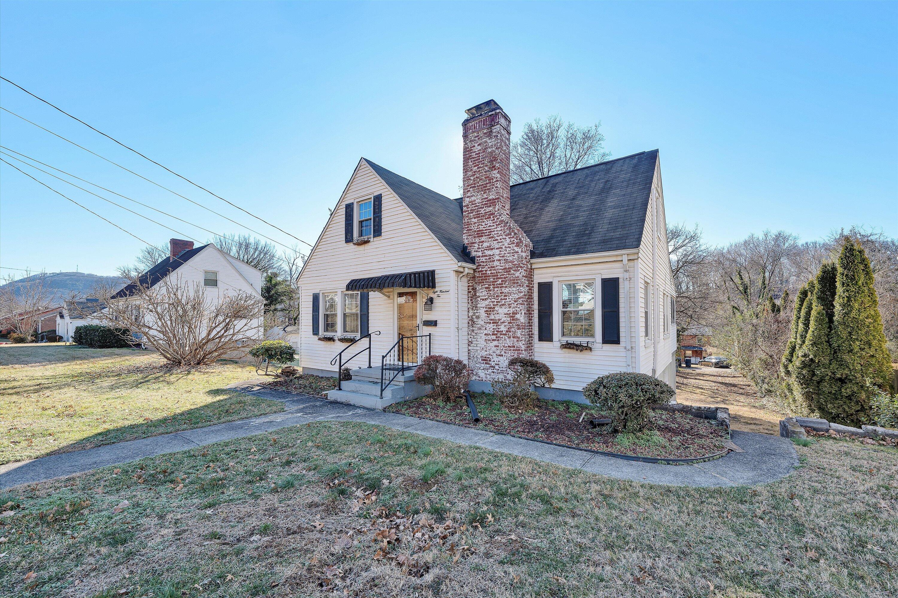 810 Windsor Avenue Southwest Roanoke, VA 24015 - Photo 2 of 21 a front view of a house with garden