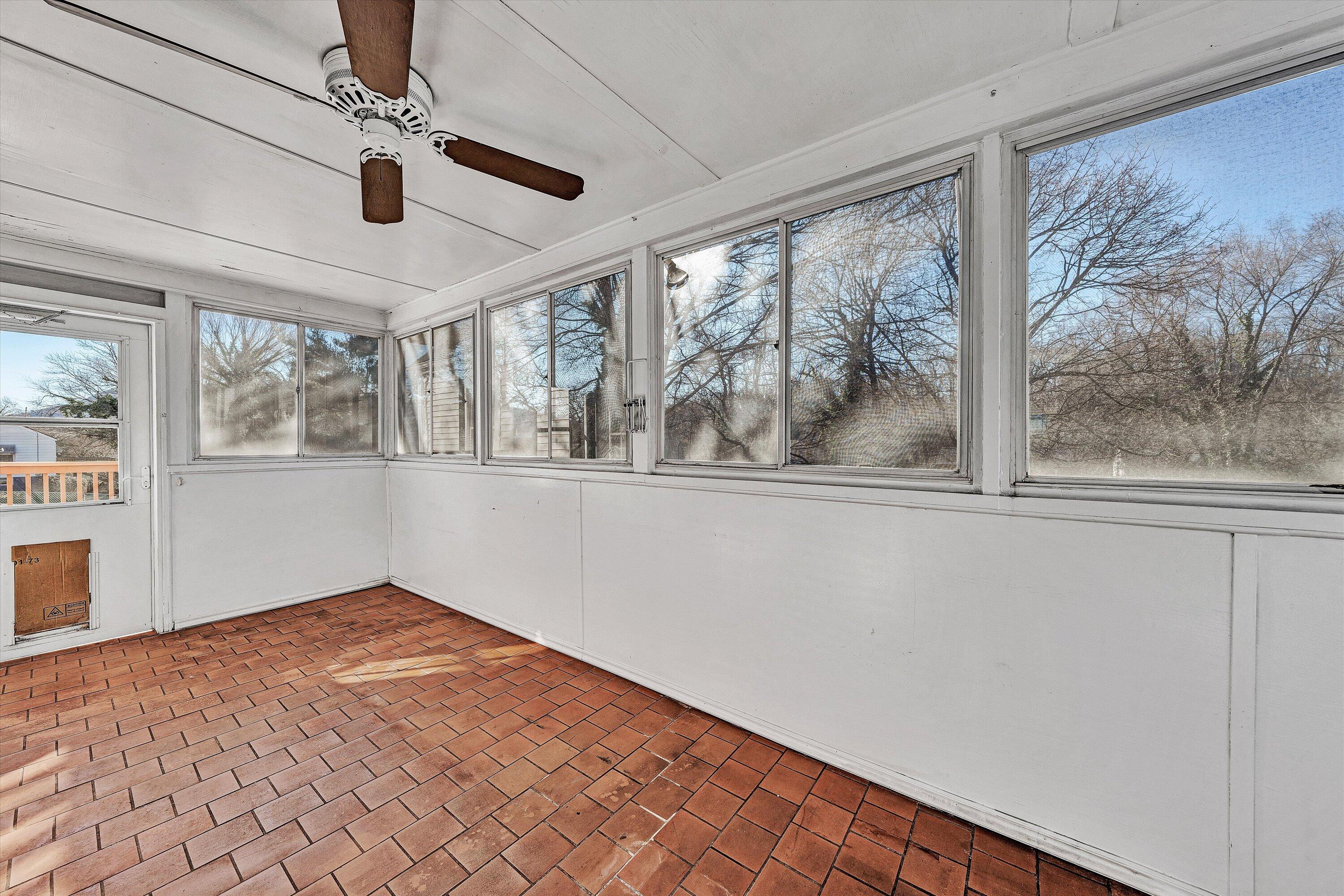 810 Windsor Avenue Southwest Roanoke, VA 24015 - Photo 8 of 21 a view of empty room with wooden floor and fan