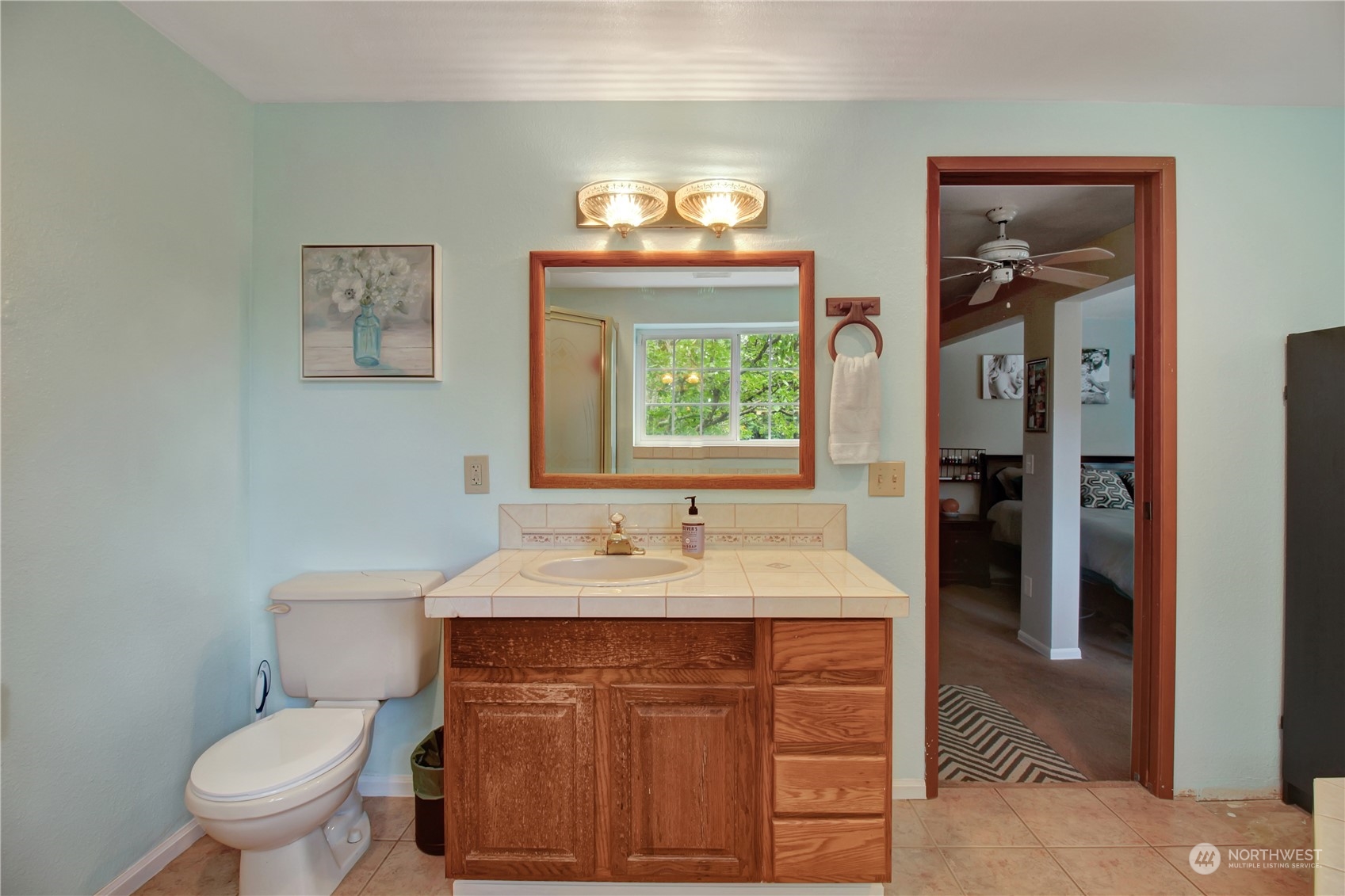 2009 South Lake Roesiger Road Snohomish, WA 98290 - Photo 26 of 39 a bathroom with a sink vanity mirror and toilet