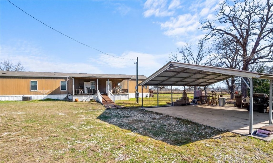 262 Cr 173 Road Marlin, TX 76661 - Photo 19 of 23 a view of a house with a backyard and sitting area