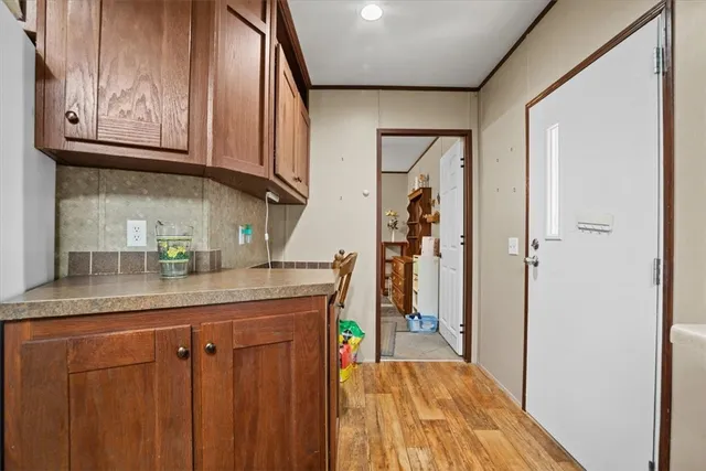 a kitchen with stainless steel appliances granite countertop a refrigerator and microwave