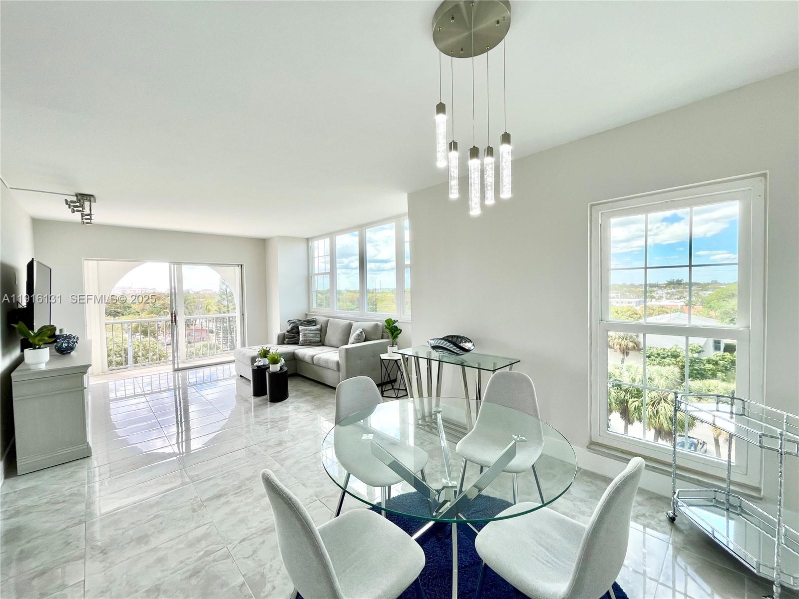 a living room with furniture or couch and a large window