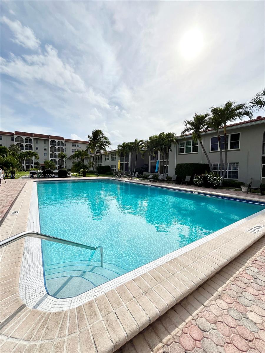 250 Northeast 20th Street, Unit 5250 Boca Raton, FL 33431 - Photo 19 of 19 a view of swimming pool with a yard