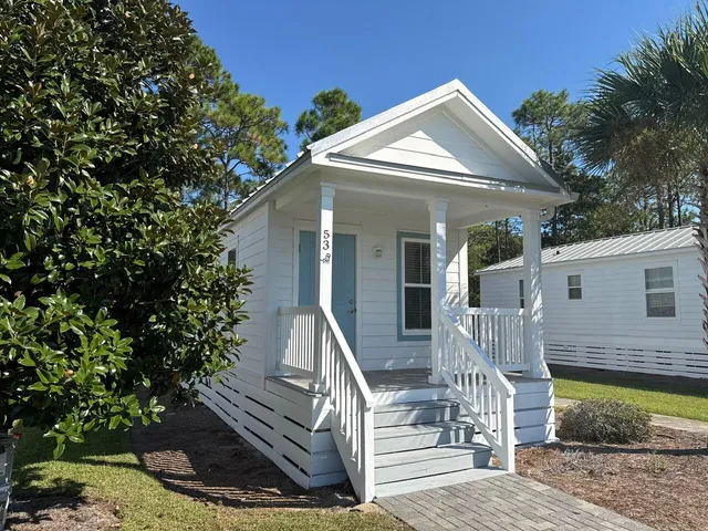 a front view of a house with a porch