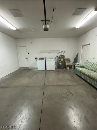 a living room with furniture and gym equipment