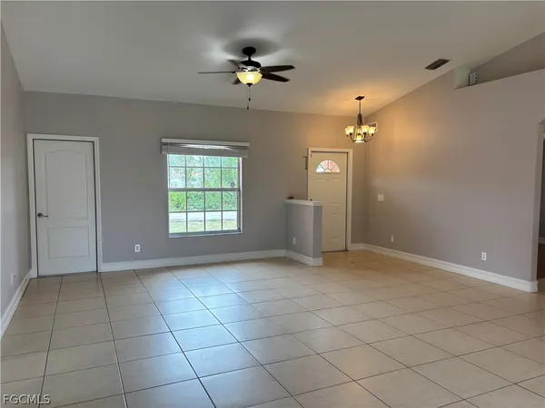 a view of an empty room with a window