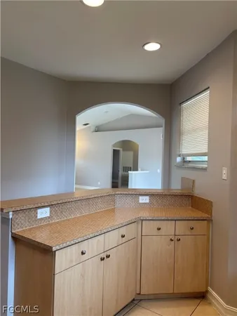 a utility room with cabinets