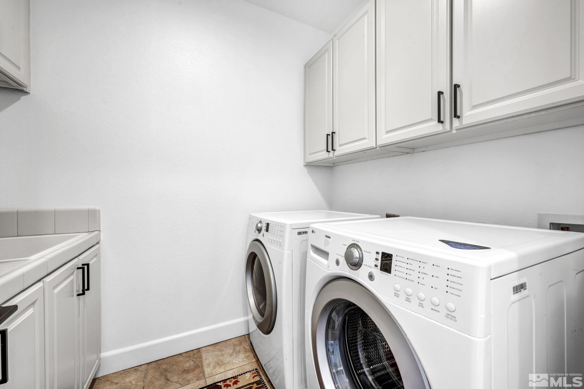 7665 Stone Bluff Way Reno, NV 89523 - Photo 18 of 40 a utility room with dryer and washer