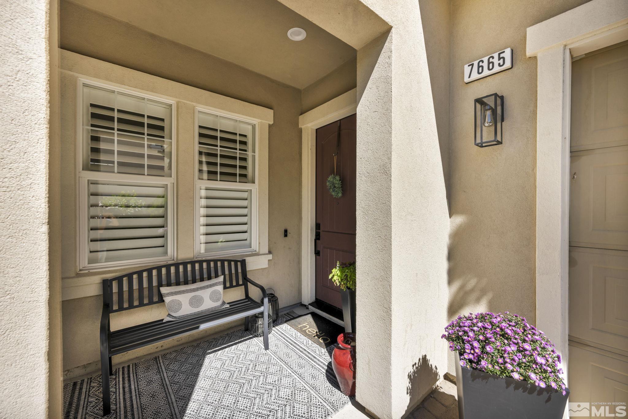 7665 Stone Bluff Way Reno, NV 89523 - Photo 2 of 40 a view of a balcony with wooden floor