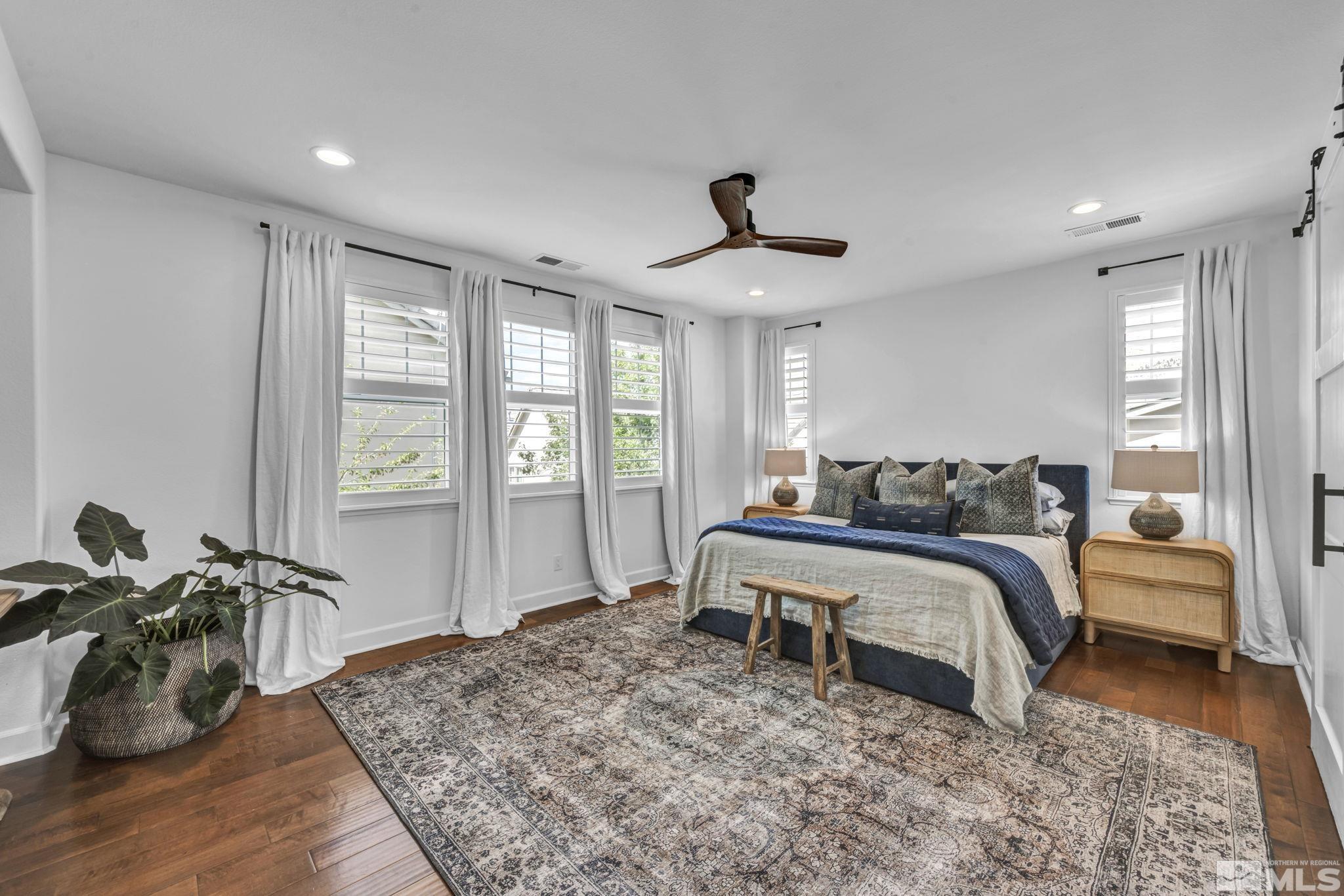 7665 Stone Bluff Way Reno, NV 89523 - Photo 25 of 40 a bed room with a bed and a couch