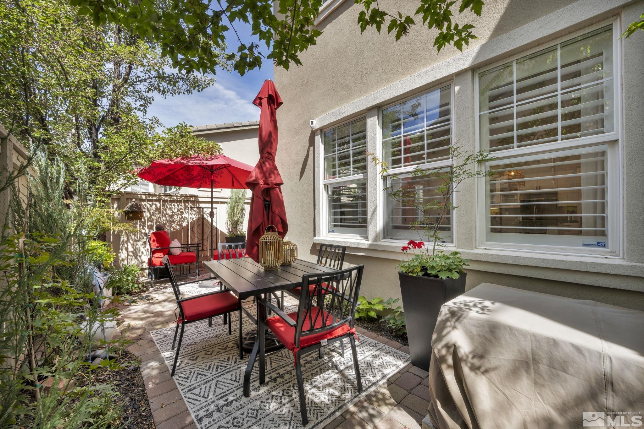 7665 Stone Bluff Way Reno, NV 89523 - Photo 34 of 40 a view of a tables and chairs in patio
