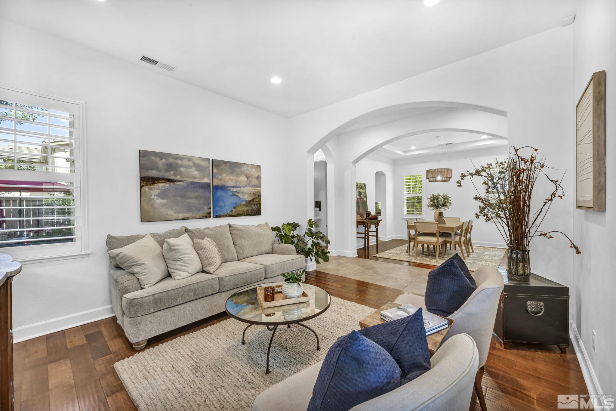 7665 Stone Bluff Way Reno, NV 89523 - Photo 5 of 40 a living room with furniture and wooden floor