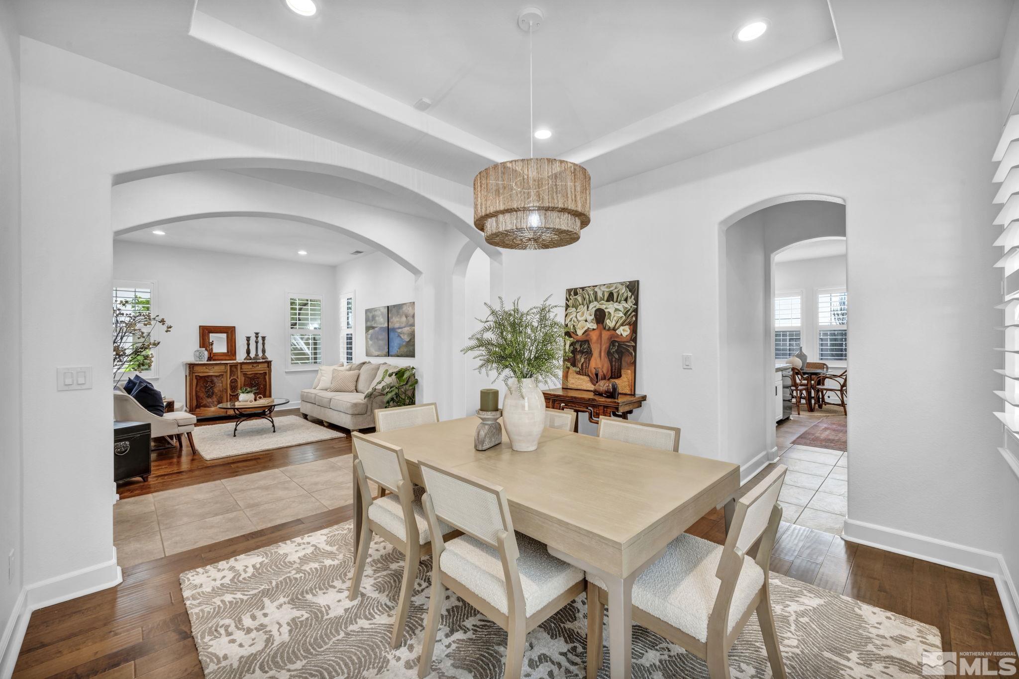 7665 Stone Bluff Way Reno, NV 89523 - Photo 7 of 40 a view of a dining room with furniture and wooden floor