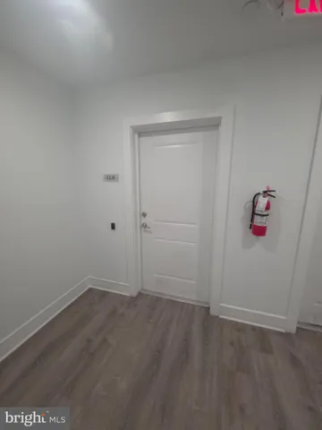 an empty room with wooden floor