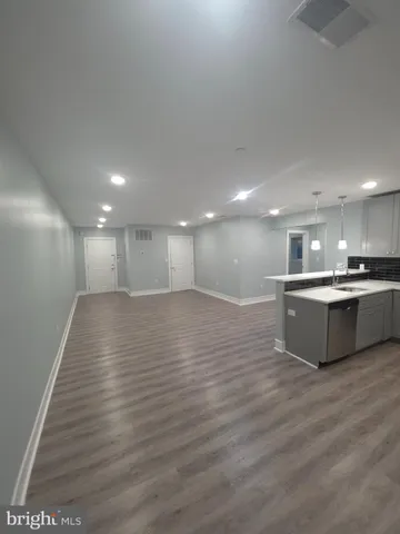 a view of kitchen with wooden floor