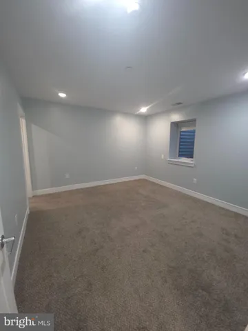 an empty room with a empty space and window