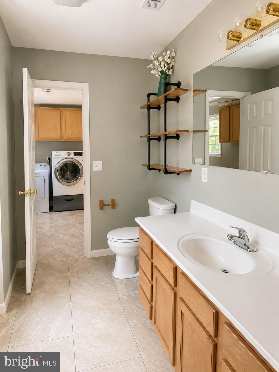 550 Walnut Shade Road Louisa, VA 23093 - Photo 5 of 7 a bathroom with a sink a toilet and mirror