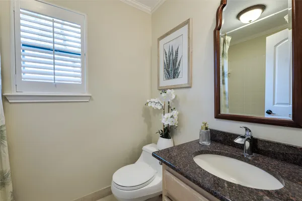 a bedroom with a bed and a bathroom