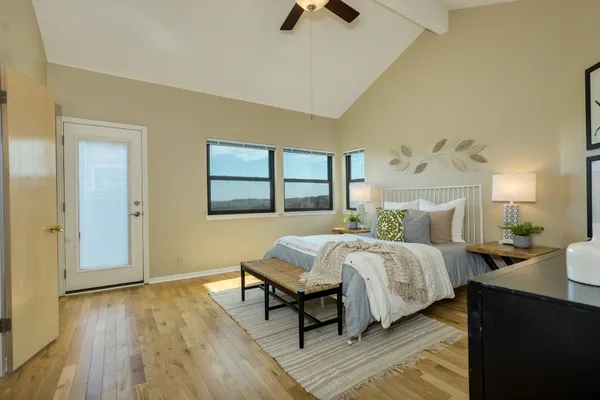 a bathroom with a granite countertop sink and a large mirror